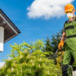 Mosquito Control Worker Spraying Garden For Mosquitoes